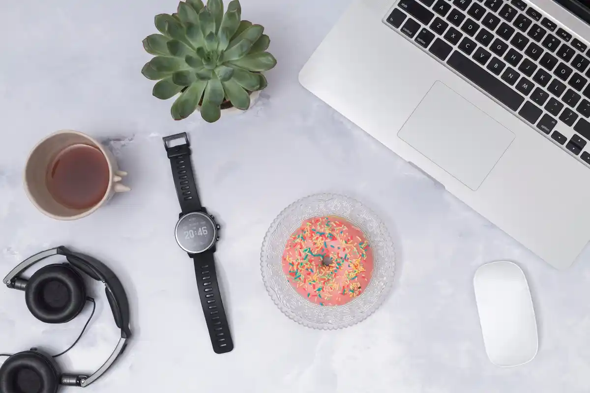 kitchen timer on desk near laptop and coffee cup