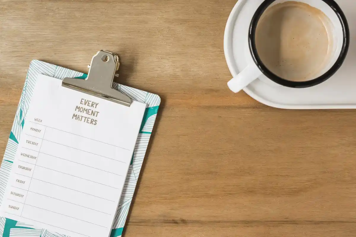 organized desk planner with coffee Dutch office environment