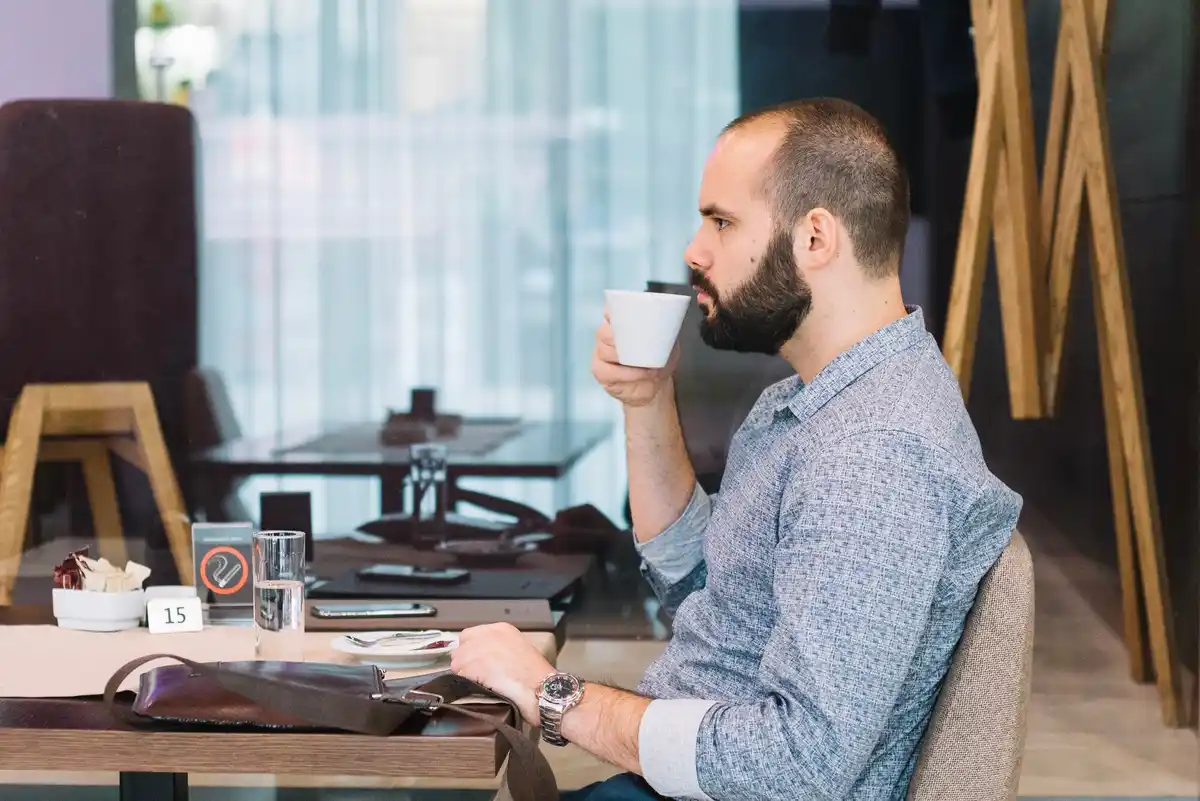 focused person working laptop coffee