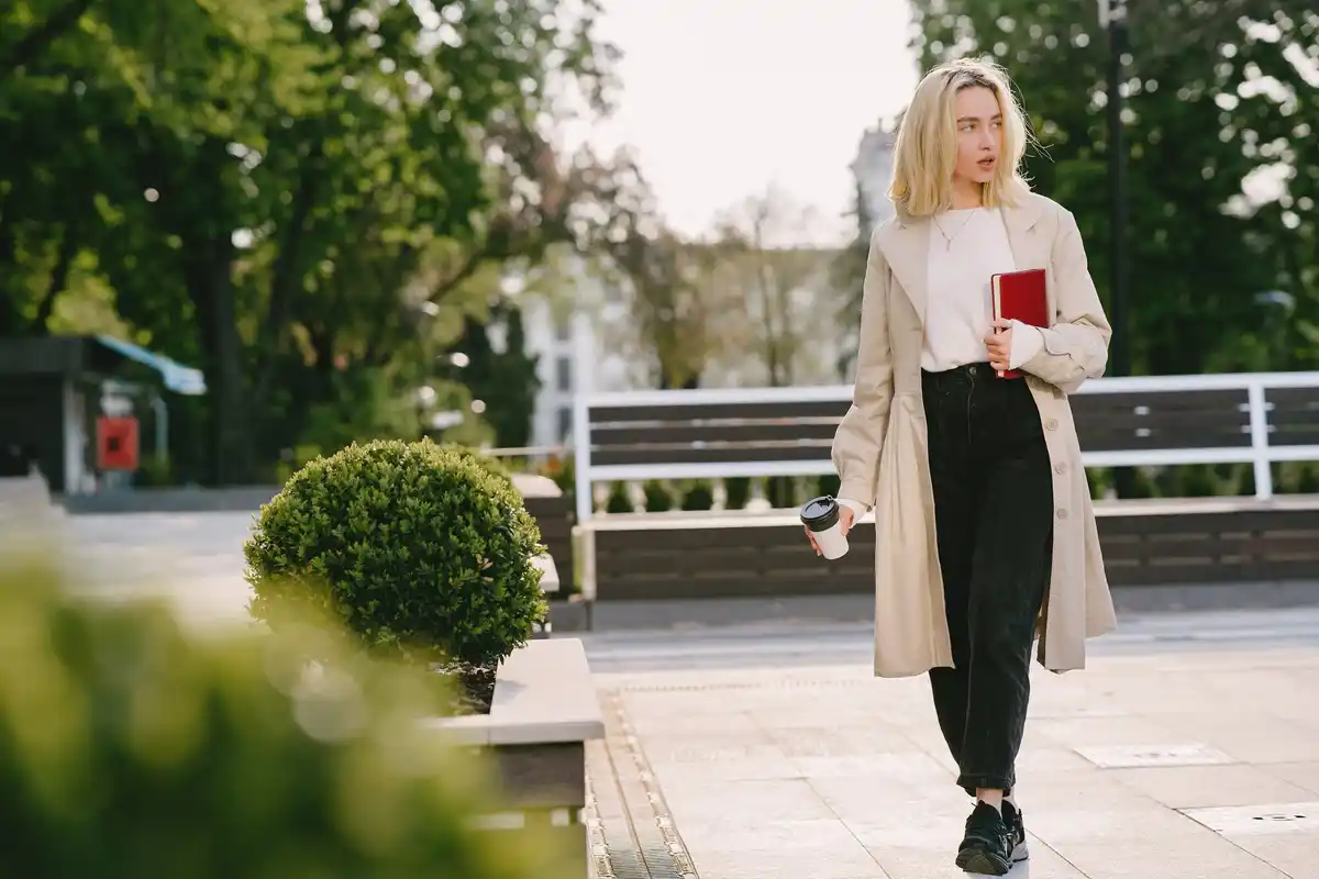 person walking outside in park to take a break from work