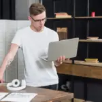 productive Dutch office worker standing desk laptop