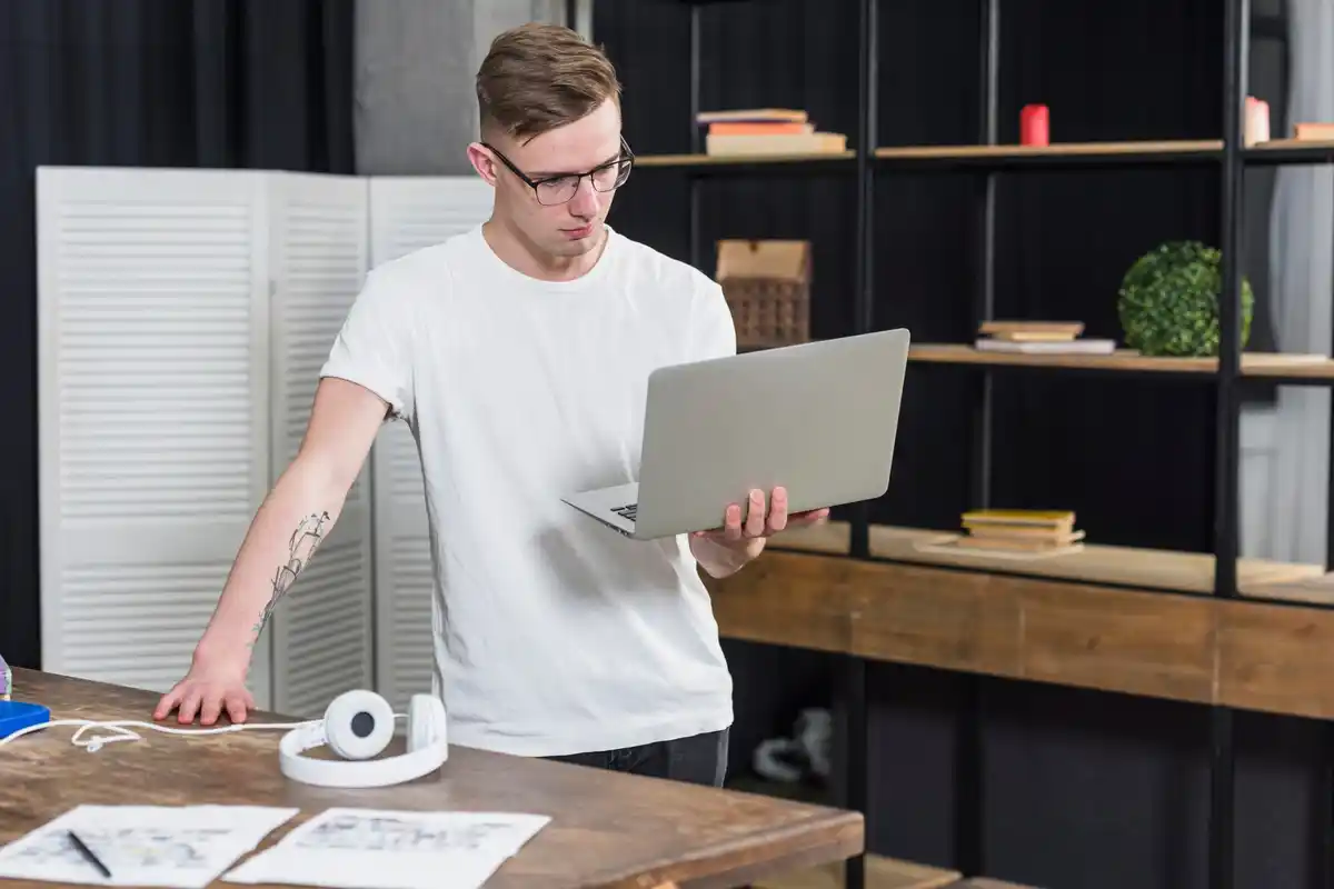 productive Dutch office worker standing desk laptop