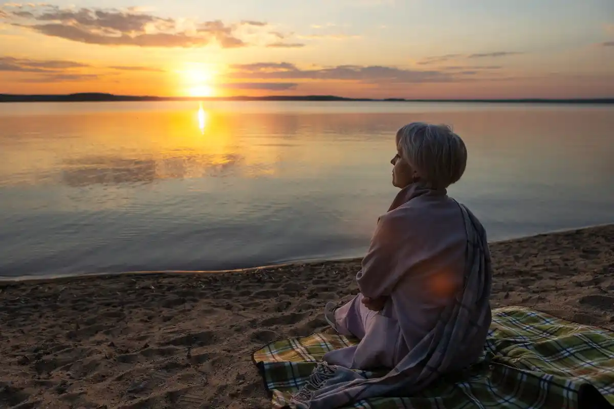 relaxed person enjoying vacation in the Netherlands beach sunset