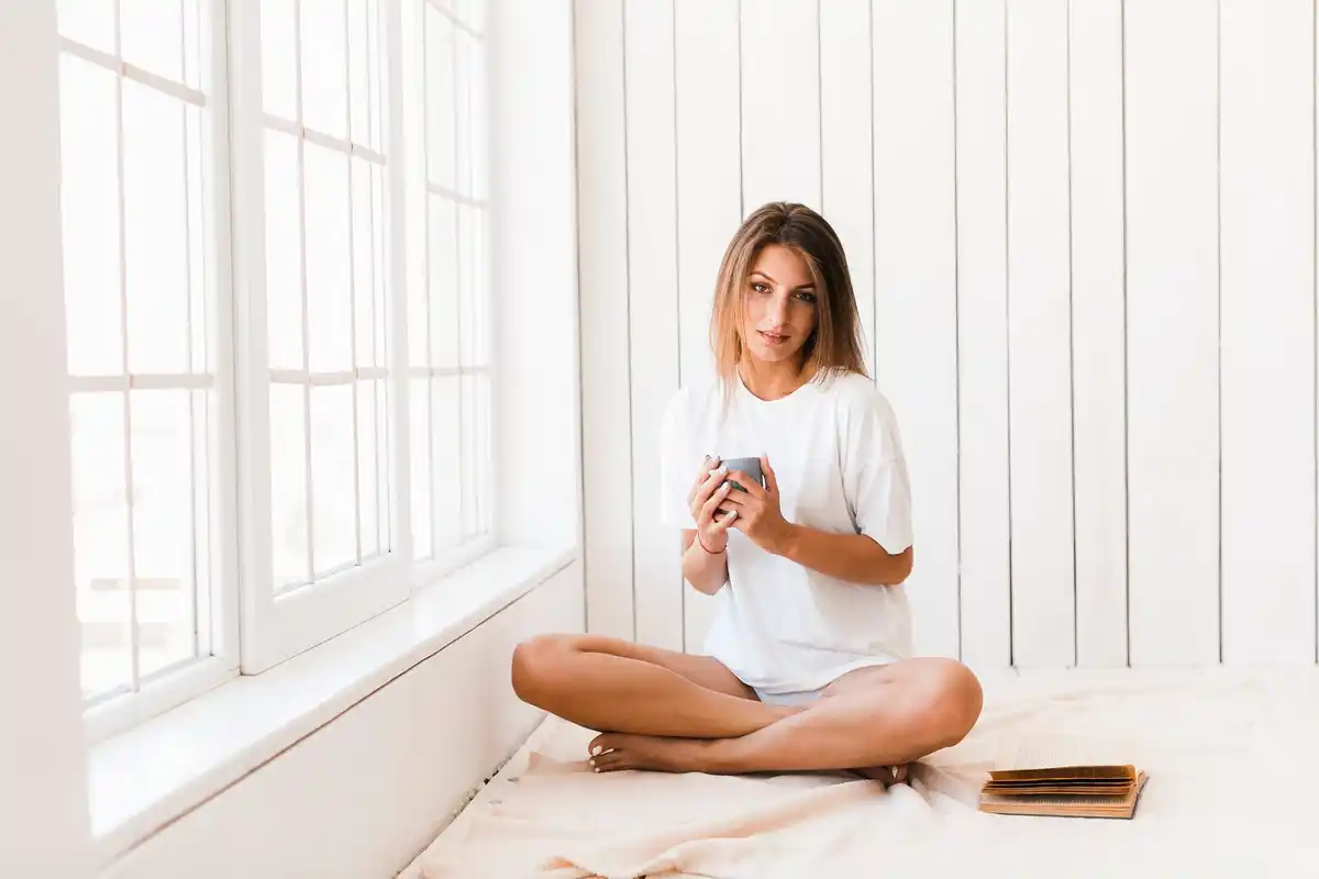person meditating at home during morning