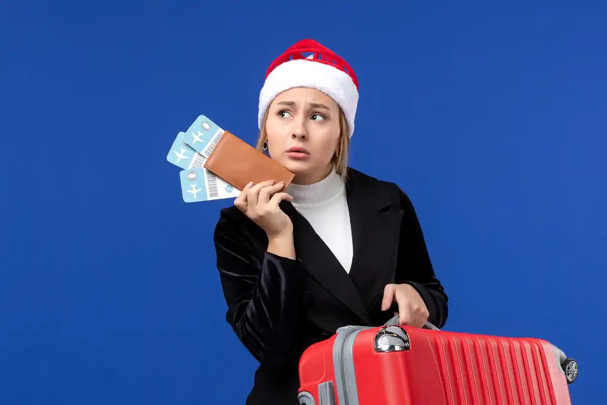 travel money saving tips suitcase airport