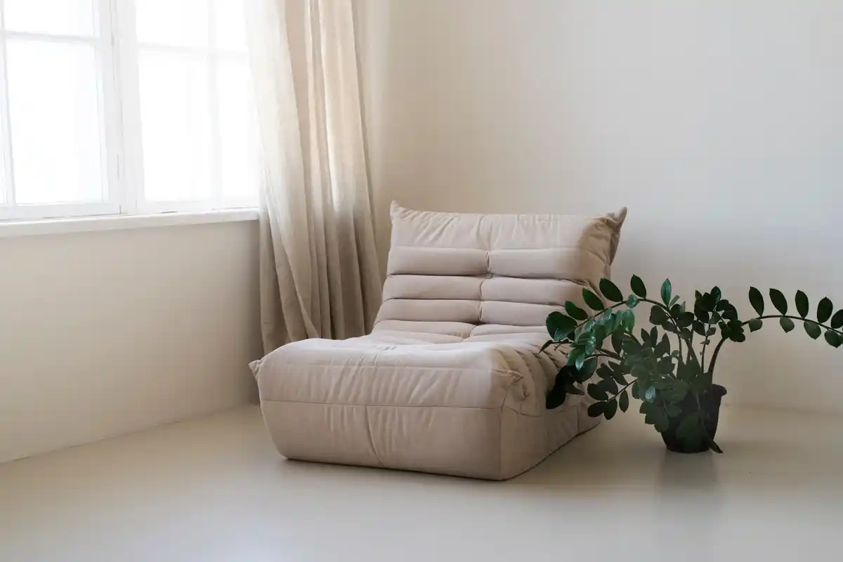 bright small living room with light walls and furniture