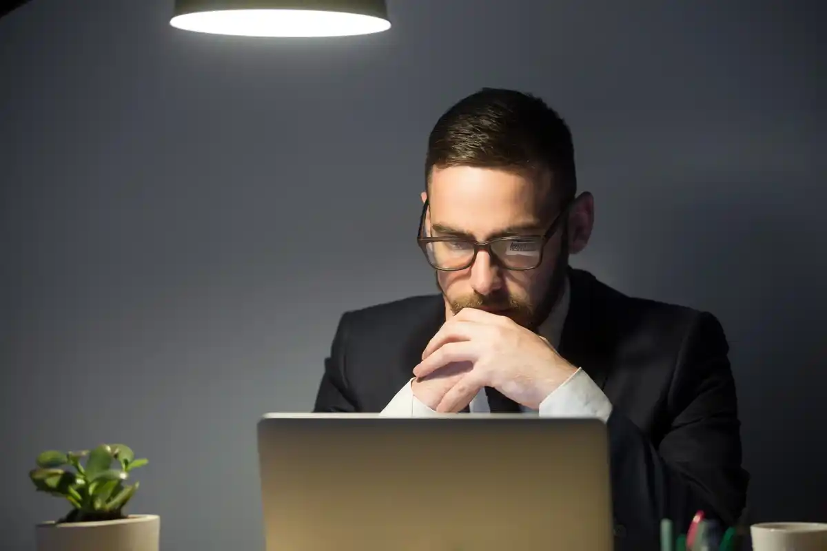 time management focused person working laptop