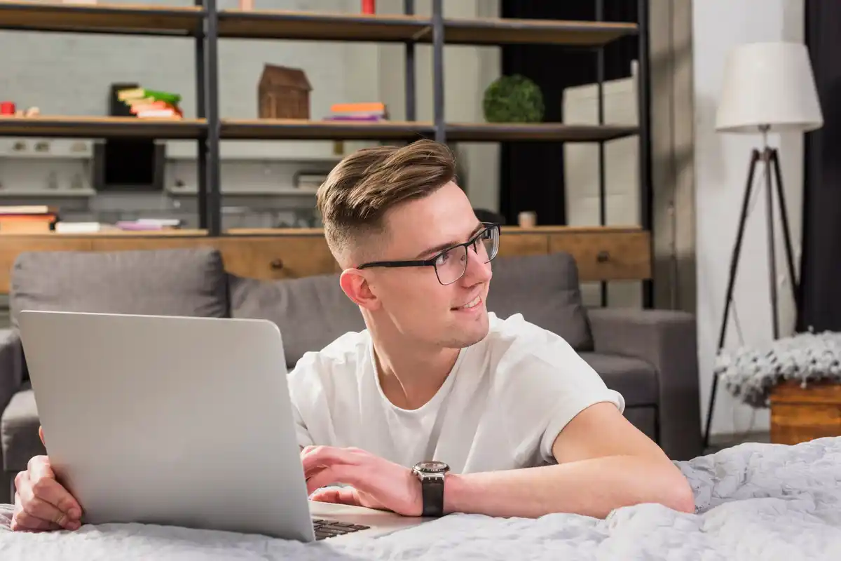 focused person working on laptop at home