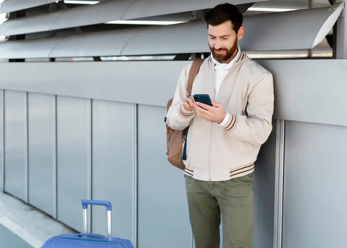person working focused with phone on airplane mode