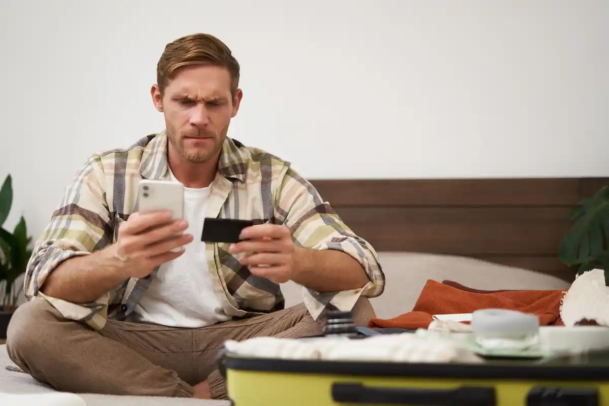 person watching tv scrolling phone time wasting