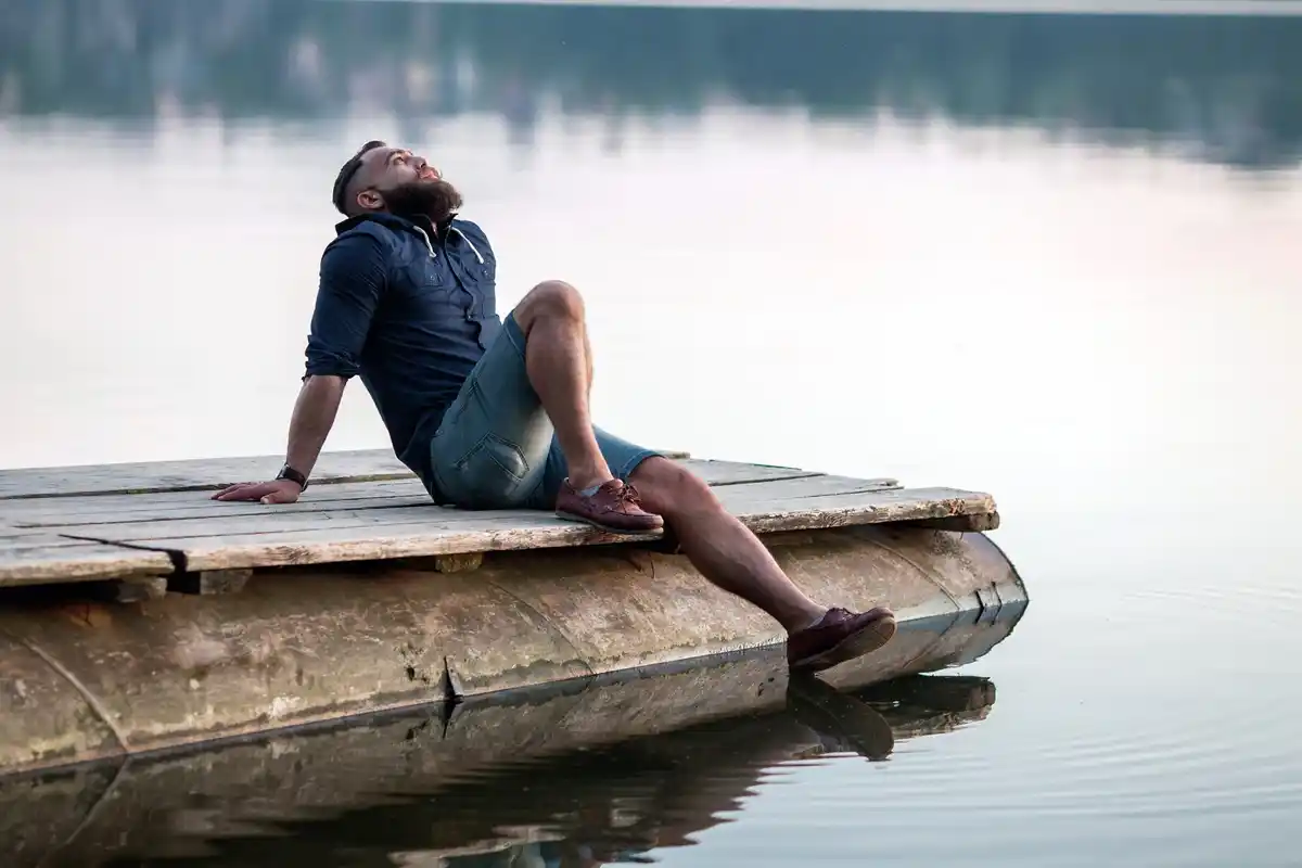 tired person deep breathing relaxation nature
