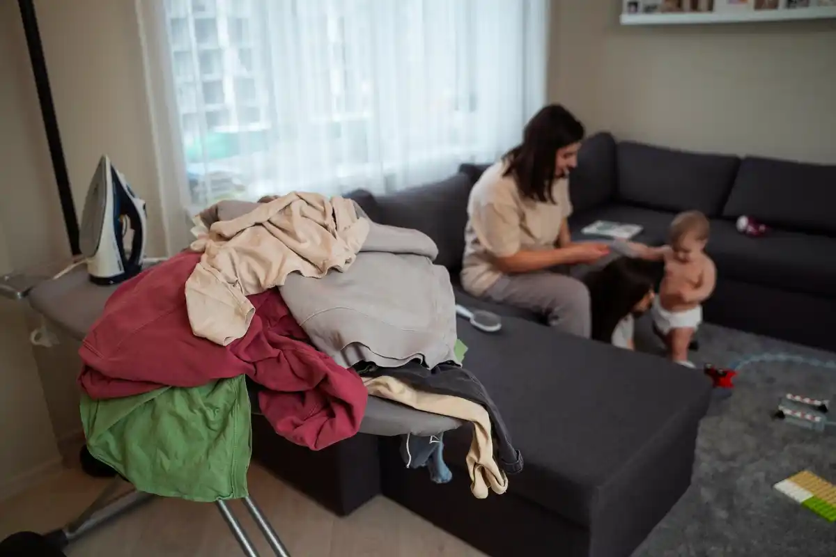 messy family living room with toys and laundry