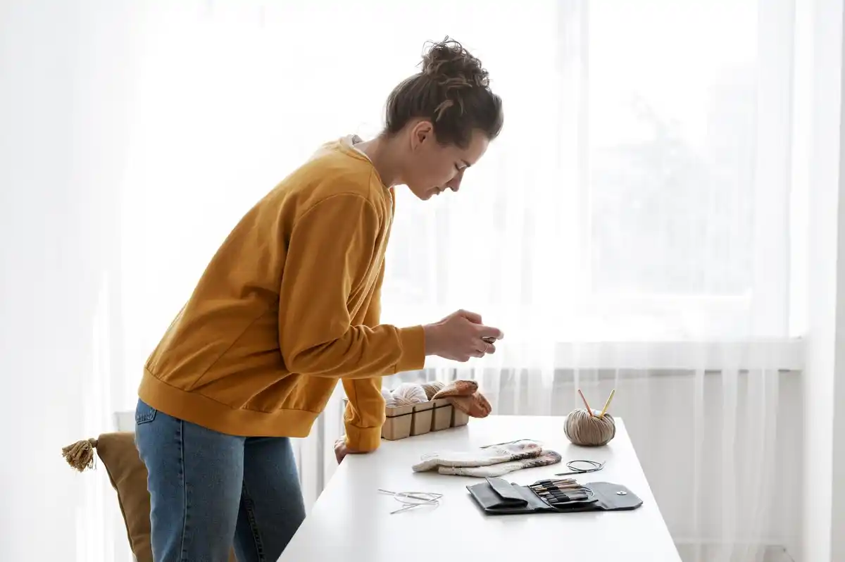 person organizing storage boxes at home, cozy interior