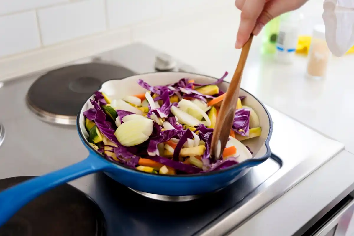 overfilled frying pan full kitchen cooking