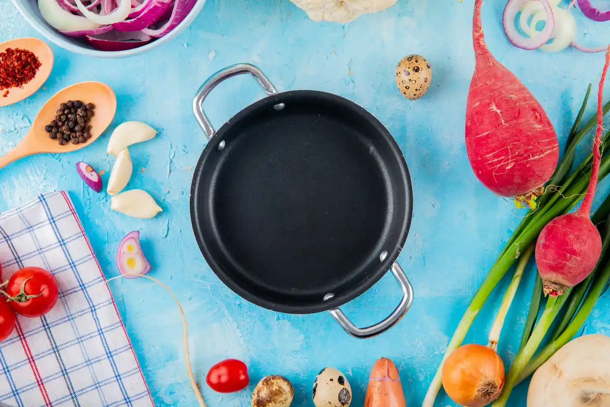 close up frying pan crowded vegetables cooking