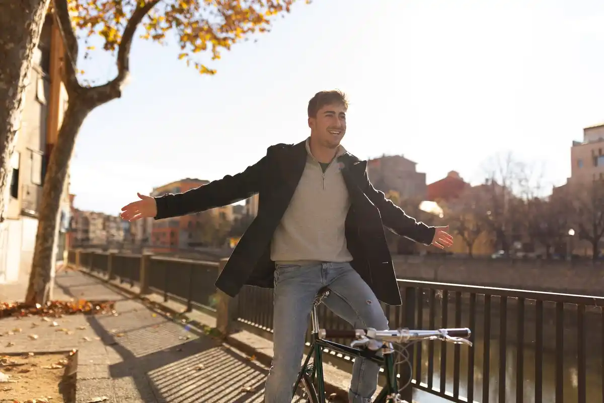 Person enjoying sunlight walking in Dutch park