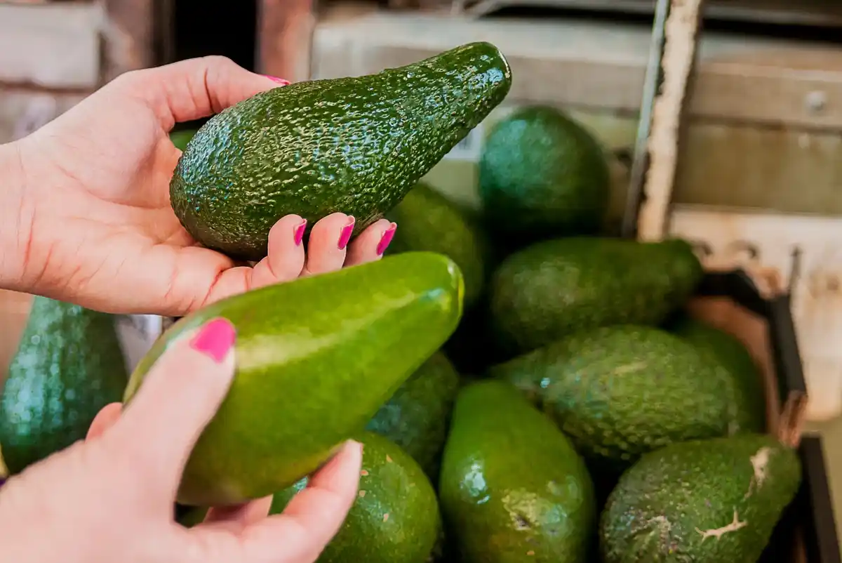 avocado ripening with banana in paper bag